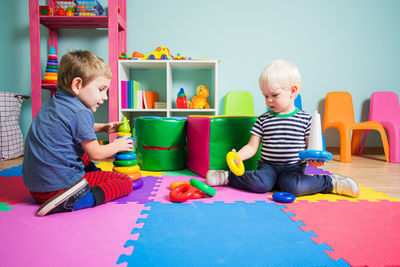 Cute boys playing with toys