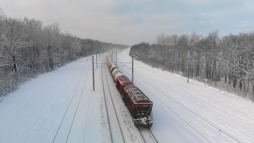 High angle view of train on snow covered landscape