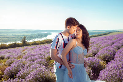 Loved people in a lavender field, a man and a woman love each other