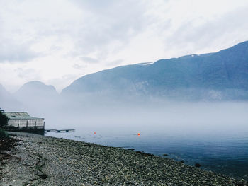 Scenic view of sea against cloudy sky