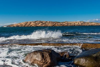 Scenic view of sea against clear sky