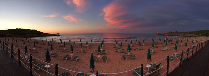 Panoramic view of beach against sky during sunset