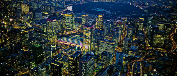 High angle view of illuminated buildings in city at night