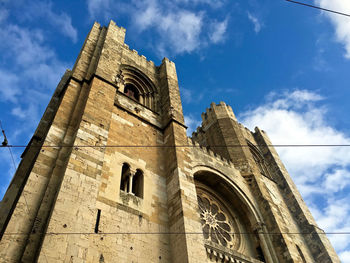 Low angle view of historic church against sky