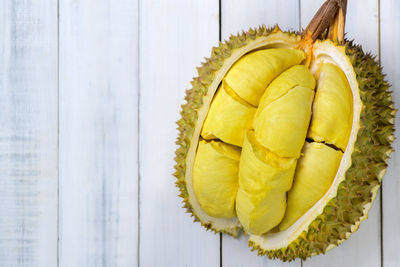 Top view of durian fruit. ripe monthong durian on white wood background, king of fruit 