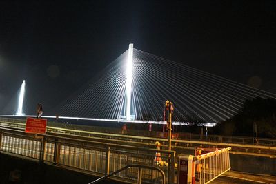 View of suspension bridge at night