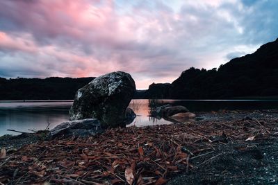 Scenic view of lake against cloudy sky