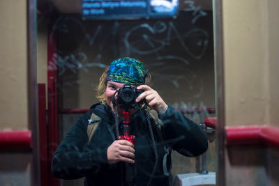 Full length of woman photographing