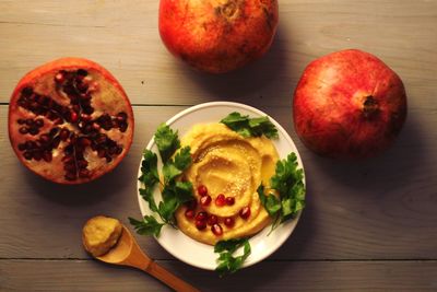 High angle view of fruits in plate on table