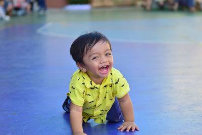 Portrait of smiling boy in swimming pool