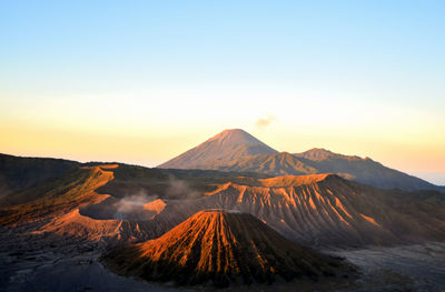 Scenic view of mountain range against sky during sunset