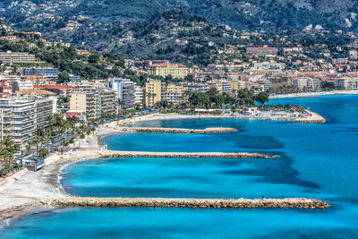 High angle view of cityscape by sea