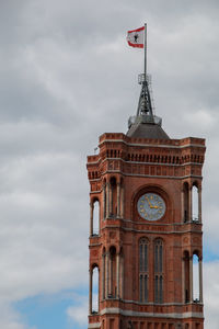 Low angle view of clock tower against sky