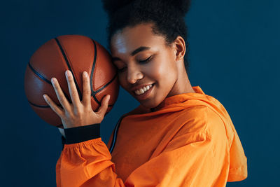 Midsection of man playing basketball