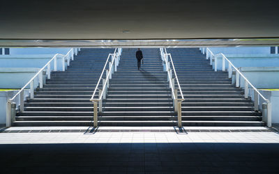 Shadow of person walking on staircase