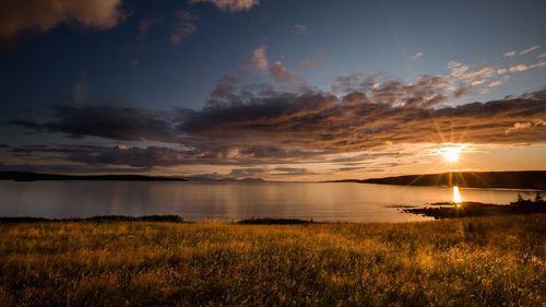 Scenic view of sunset over lake
