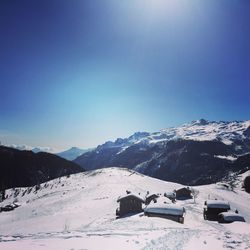 Scenic view of mountains against sky during winter