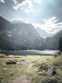 Scenic view of lake and mountains against sky