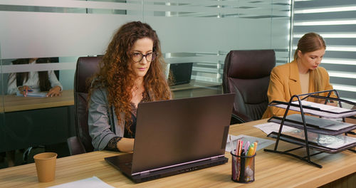 Two businesswomen working on new product release. 