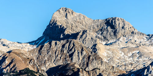 Scenic view of mountains against clear blue sky