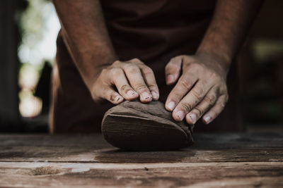 Close-up of artist making pot at workshop