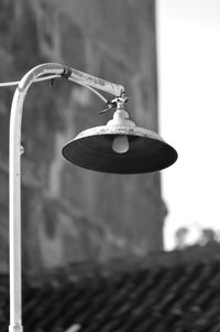 Close-up of bell hanging against wall