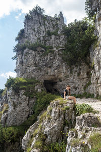 Woman sitting on rock