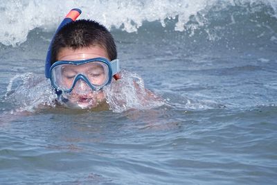 Portrait of man swimming in sea