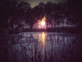 Scenic view of lake against sky during sunset