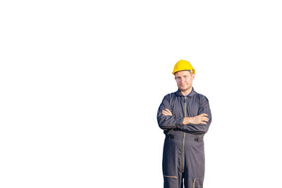 Portrait of man working against white background