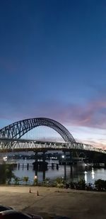 Bridge against blue sky in city