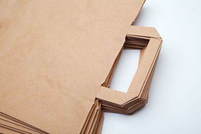 Close-up of lamp against white wall