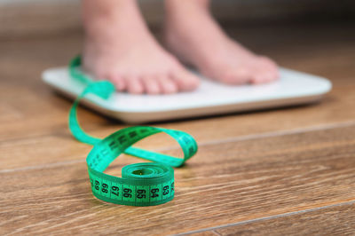 Barefoot woman standing on a digital scale. the concept of diet, weight loss and healthy lifestyle