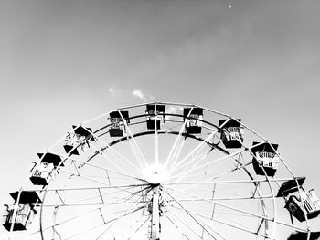 Low angle view of ferris wheel against sky