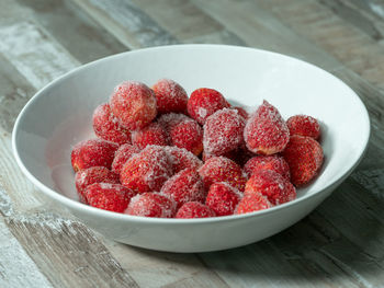 Close-up of strawberries in bowl on table