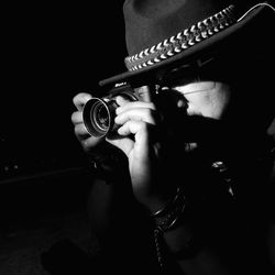 Close-up of a hand holding camera