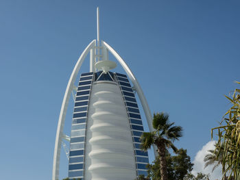 Low angle view of building against clear blue sky