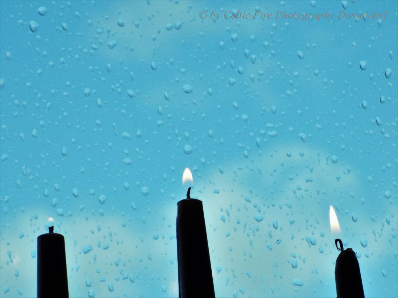 LOW ANGLE VIEW OF WET GLASS WINDOW IN RAIN