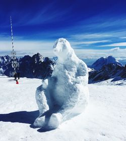 Scenic view of snowcapped mountain against sky