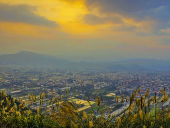 Aerial view of cityscape against sky