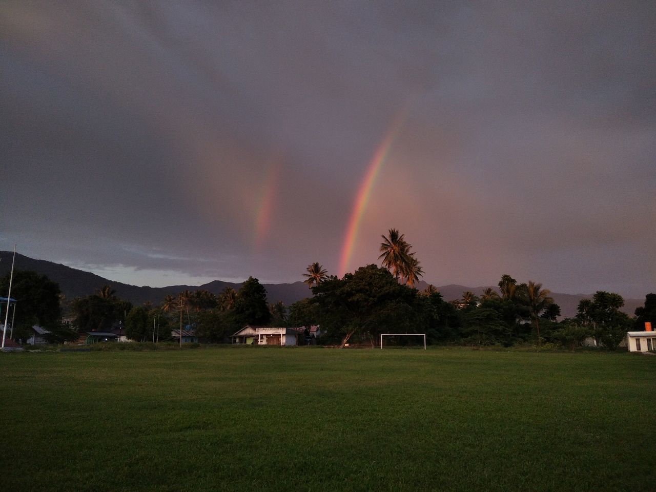 SCENIC VIEW OF RAINBOW AGAINST SKY