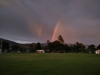 Scenic view of rainbow over field