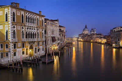 View of illuminated buildings in city