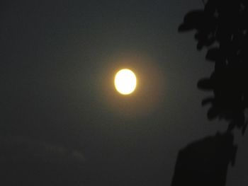 Low angle view of sun shining in sky at night