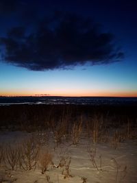 Scenic view of beach against sky during sunset