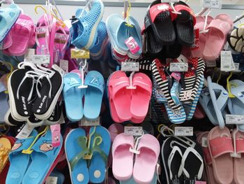 Full frame shot of multi colored shoes for sale at market stall