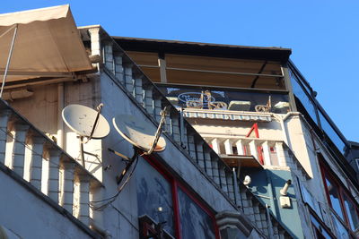 Low angle view of buildings against blue sky