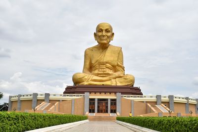 Low angle view of statue against sky