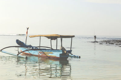 Fisherman at indian ocean coastline