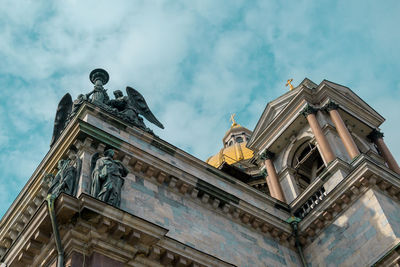 Low angle view of statue against sky